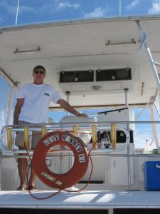 Click to enlarge image CAPT TOMMY ON FLYING BRIDGE - The Fly Bridge of the Blue Runner 2 - 
